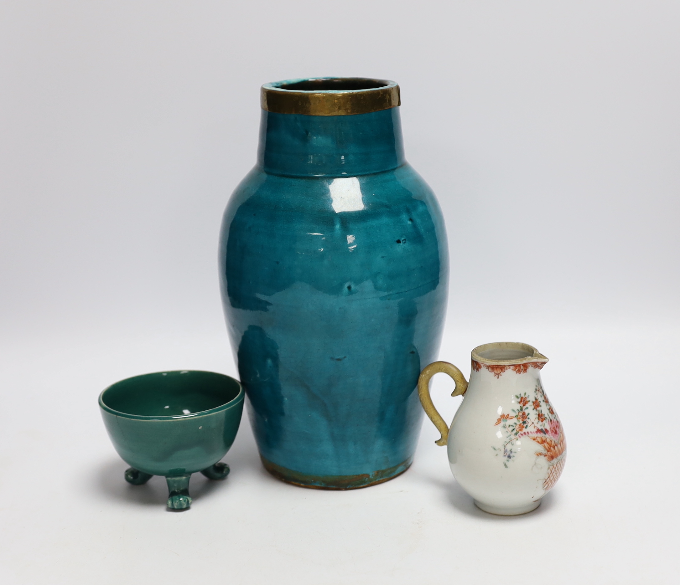 A turquoise glazed three footed bowl and jug and a small Chinese famille rose jug, largest 25cm high